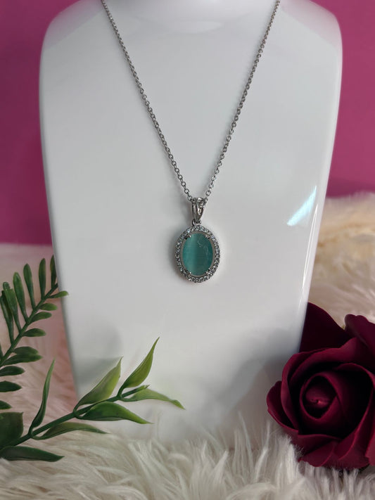 Silver Oval Pendant with Teal Green Crystal